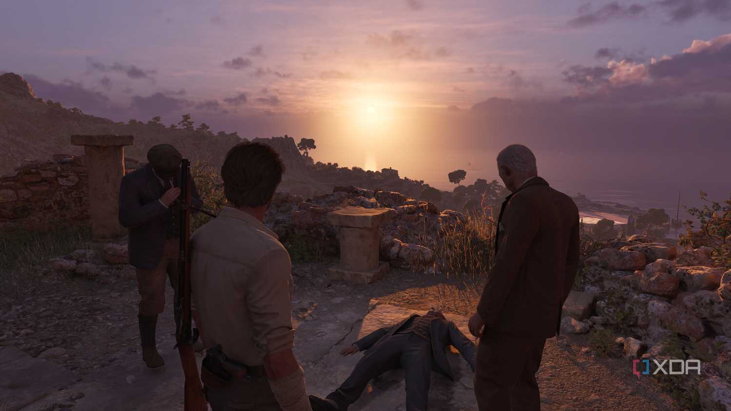 Enzo and Tino Russo standing over an unconscious person at sunset in Mafia: The Old Country.