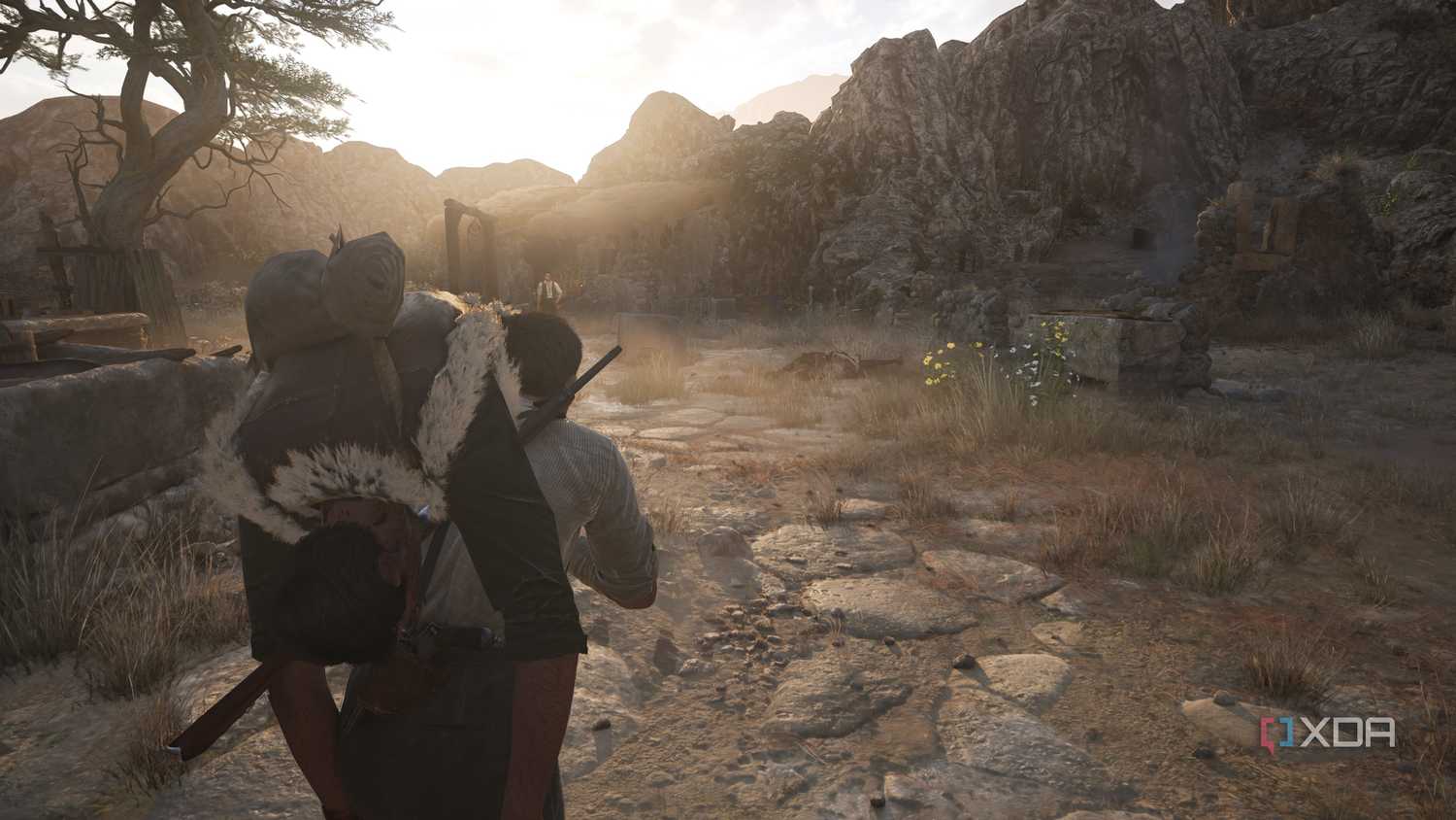 Enzo carrying a corpse towards Cesare in Mafia: The Old Country.