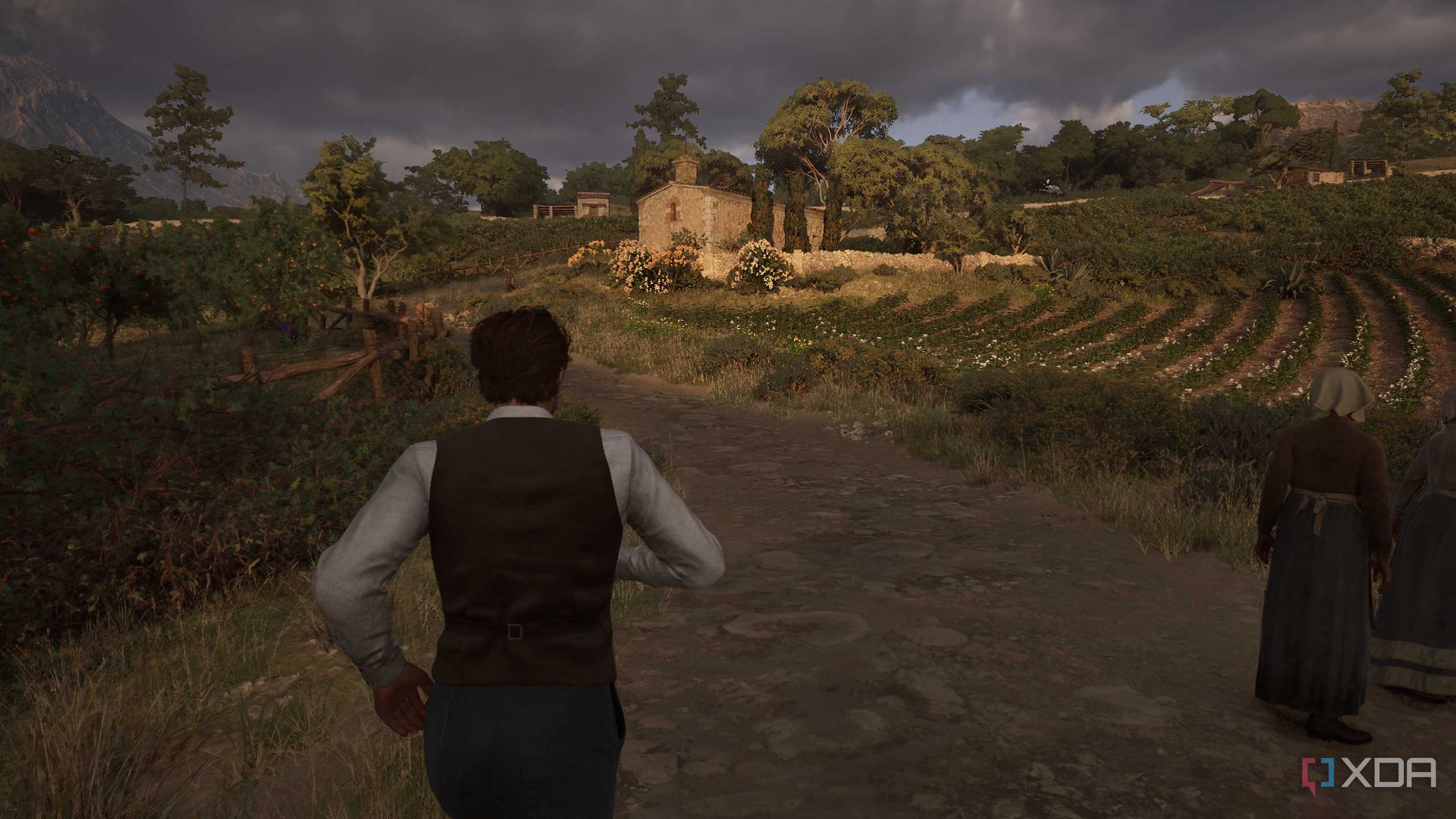 Enzo jogging towards a chapel at sunset in Mafia: The Old Country.