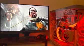 A PC with an image of Gordon Freeman struggling with a barnacle on the monitor.