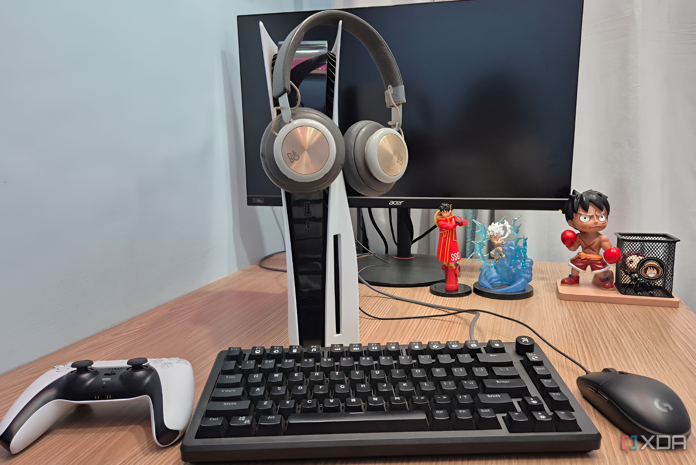 Headphones hanging on a PlayStation 5 console.