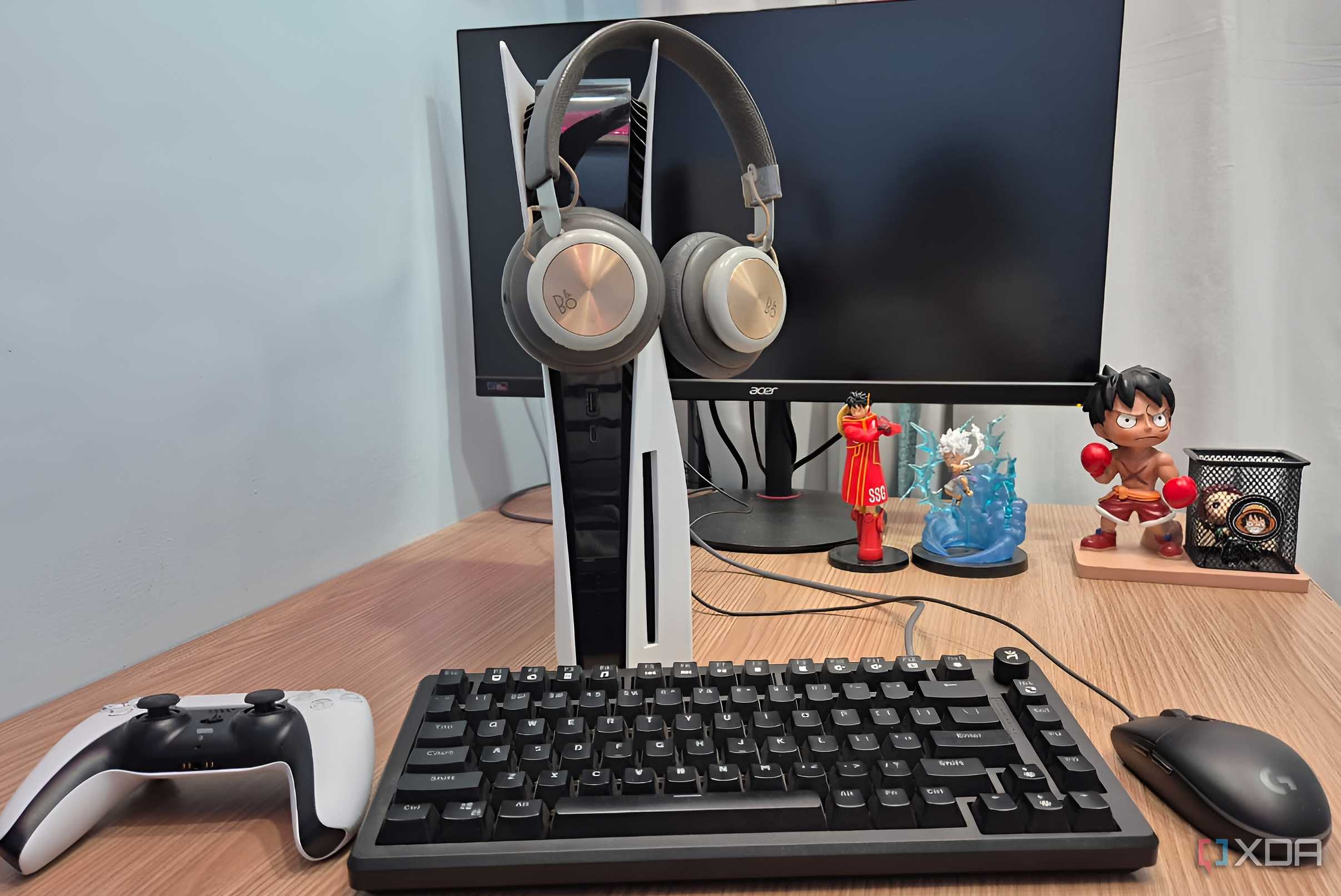 Headphones hanging on a PlayStation 5 console.