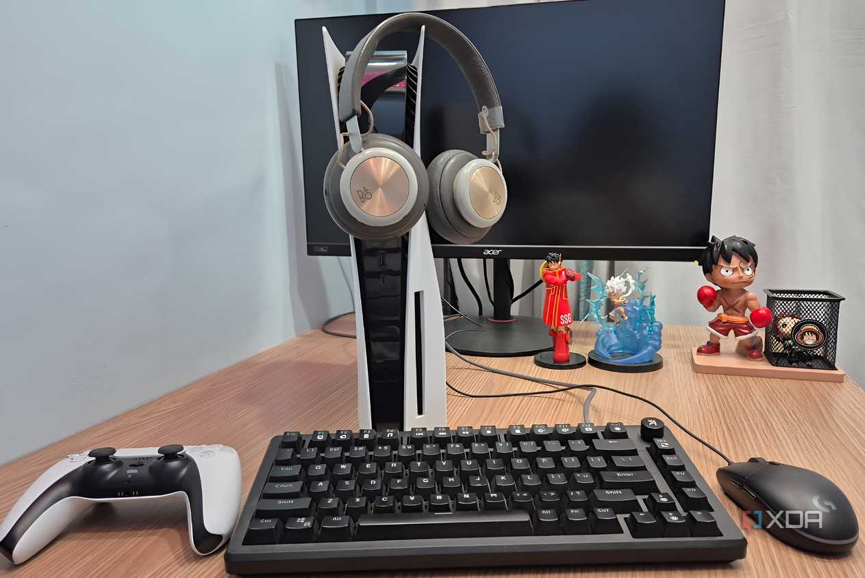 Headphones hanging on a PlayStation 5 console.
