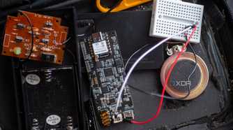 ReSpeaker Lite connected to a breadboard with wires to a speaker