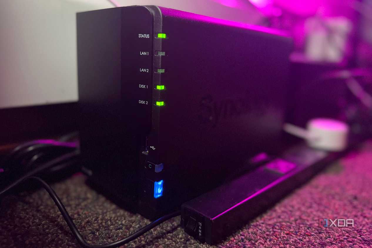 Synology NAS on a carpet next to a power strip