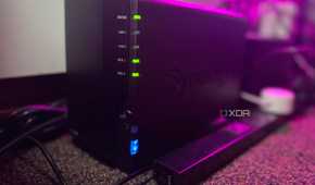 Synology NAS on a carpet next to a power strip