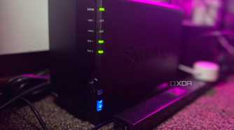 Synology NAS on a carpet next to a power strip