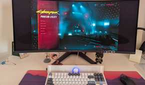 An ultrawide monitor showing the main menu of Cyberpunk 2077