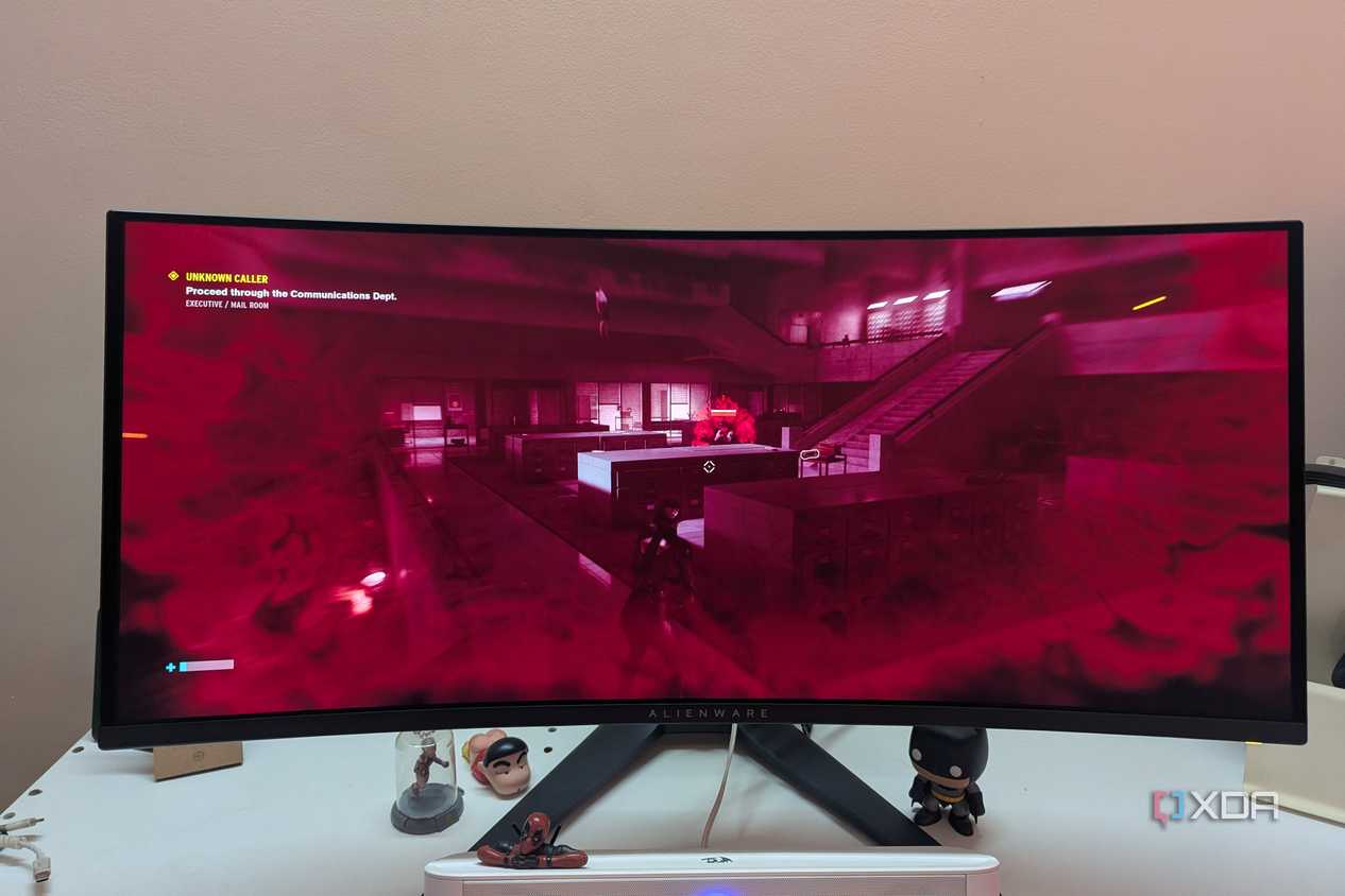 An ultrawide OLED monitor playing Control