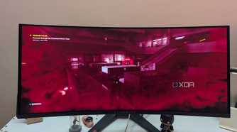 An ultrawide OLED monitor playing Control