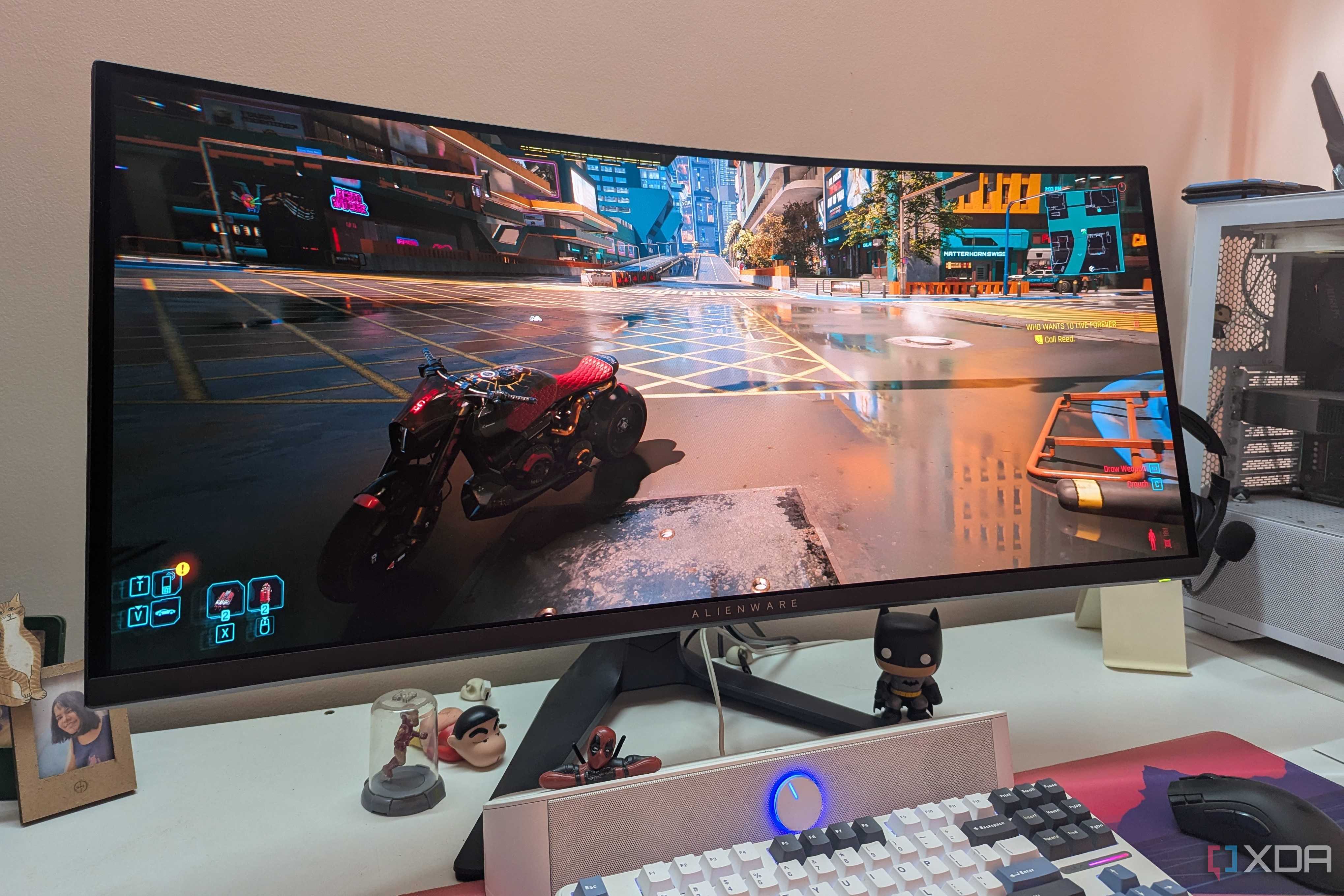 An image of an ultra-wide monitor running Cyberpunk 2077.