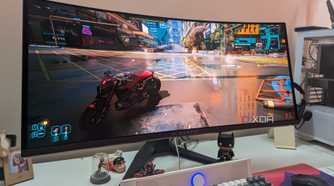 An image of an ultra-wide monitor running Cyberpunk 2077.