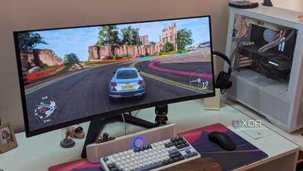 An ultra-wide OLED monitor playing Forza Horizon 4