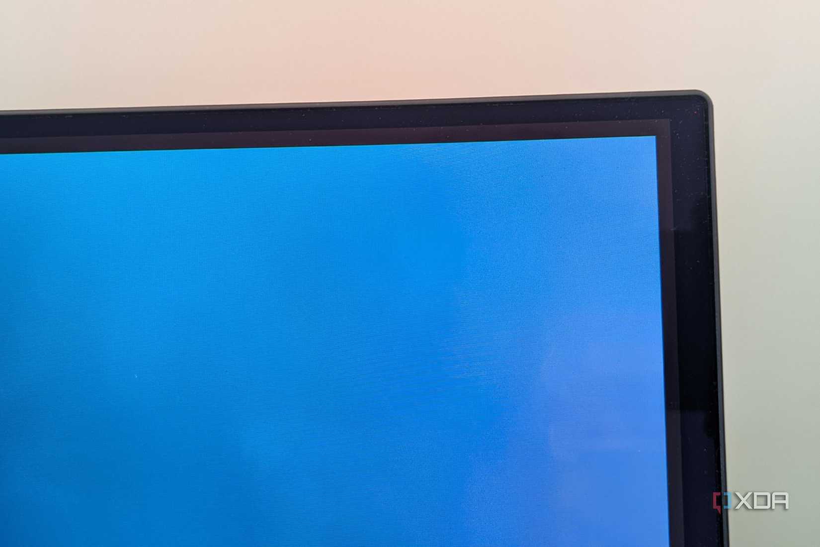 Close-up of a monitor screen showing gap between the image and the bezels