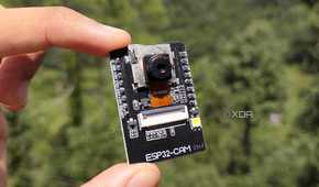 A person holding the ESP32 CAM board