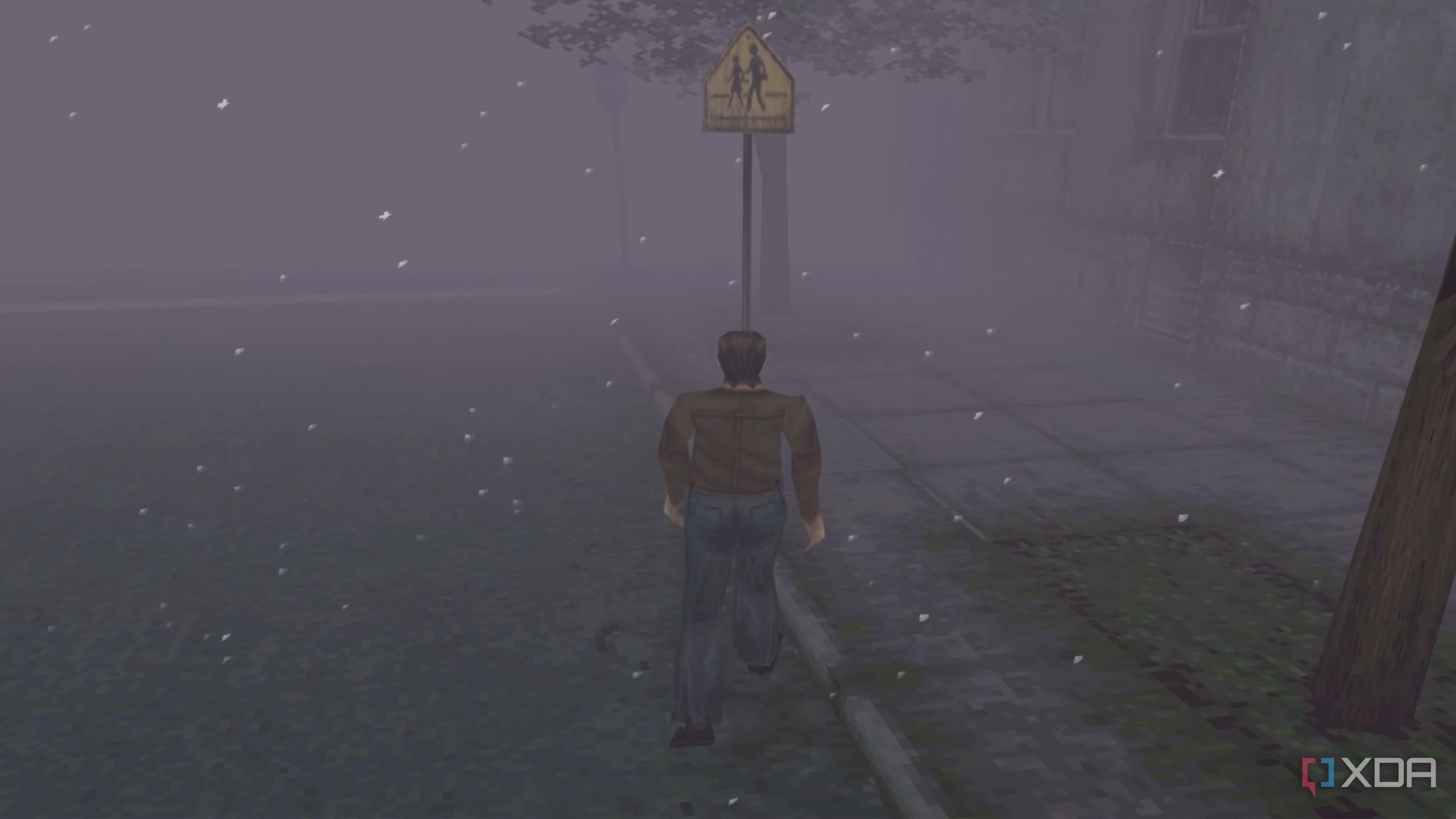 Harry Mason walking through Silent Hill in 1999's Silent Hill.