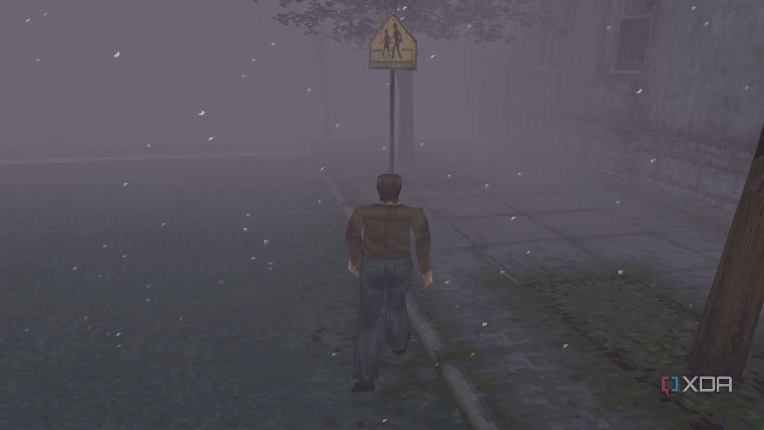 Harry Mason walking through Silent Hill in 1999's Silent Hill.