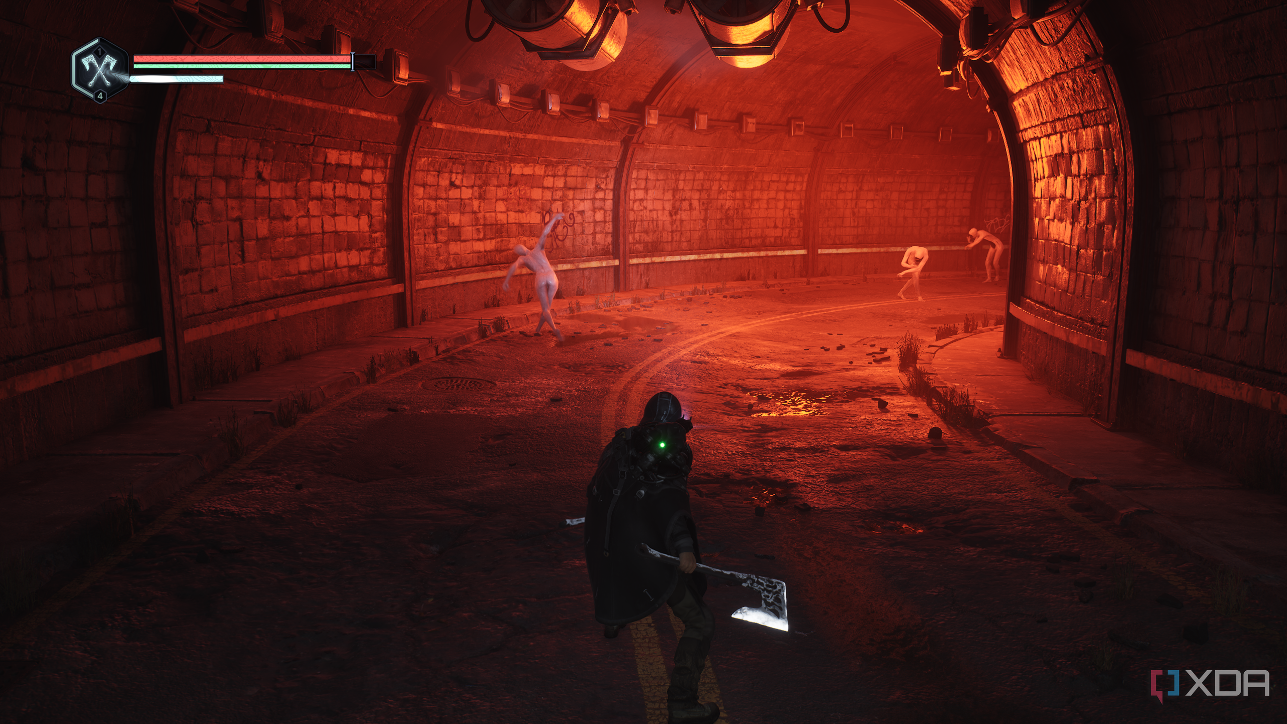 A tunnel bathed in red light in Hell is Us.