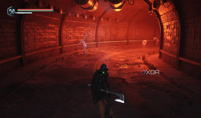 A tunnel bathed in red light in Hell is Us.