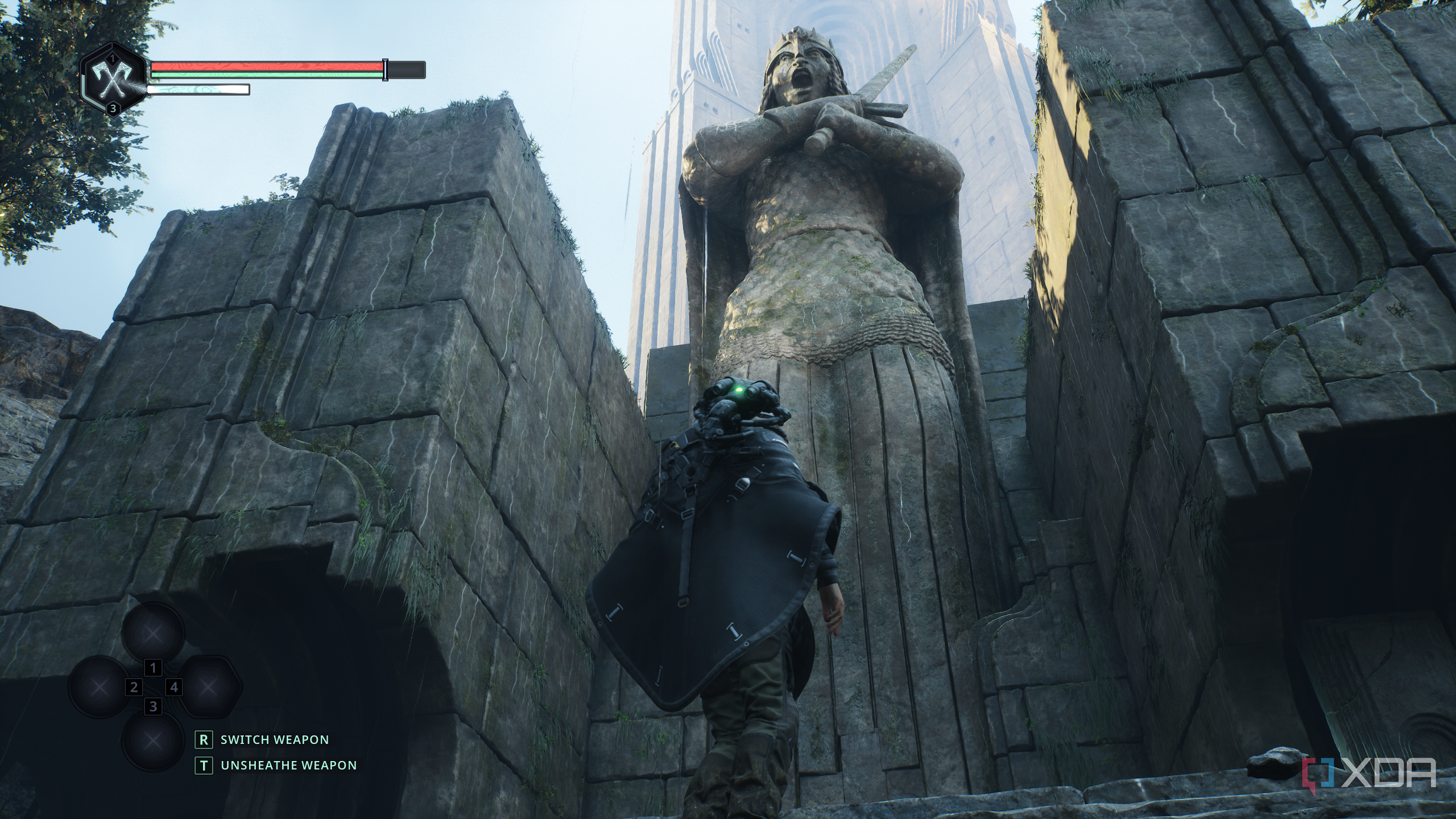 Remi standing next to a gigantic statue in Hell is Us.
