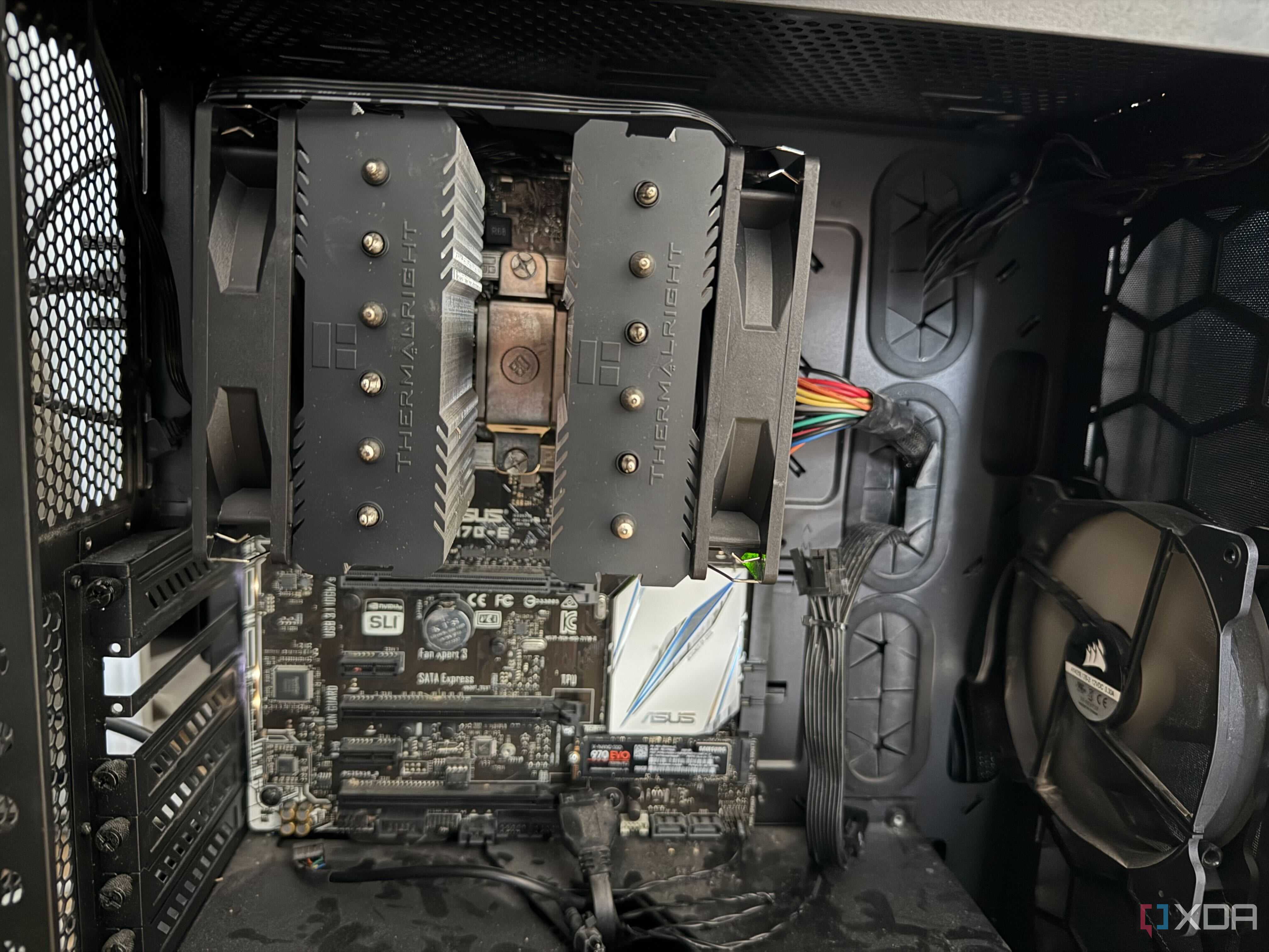 A photo of the inside of a PC, showing a CPU cooler with the fans attached incorrectly