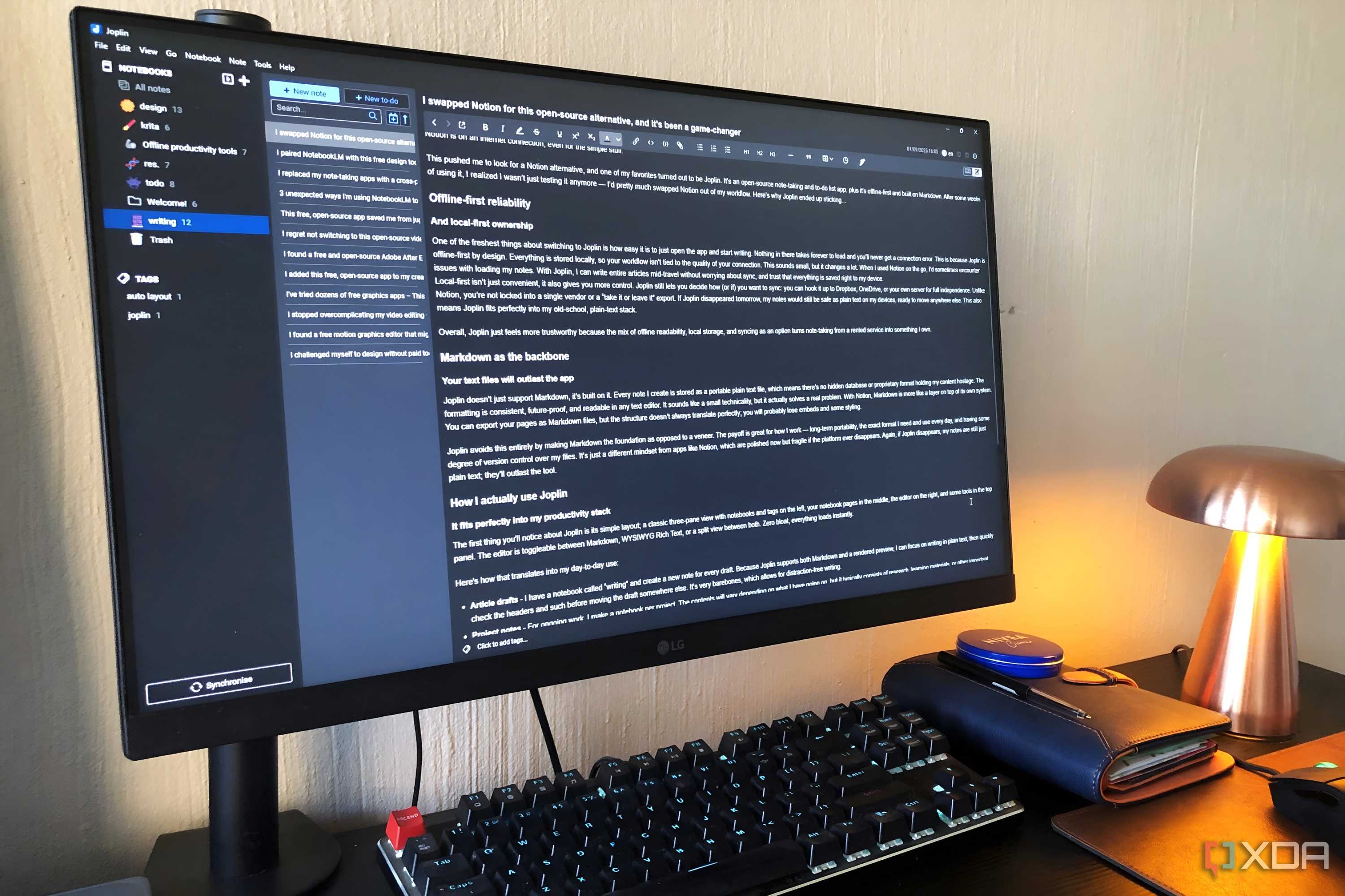 Joplin editor displayed on windows pc, notebook and lamp in view