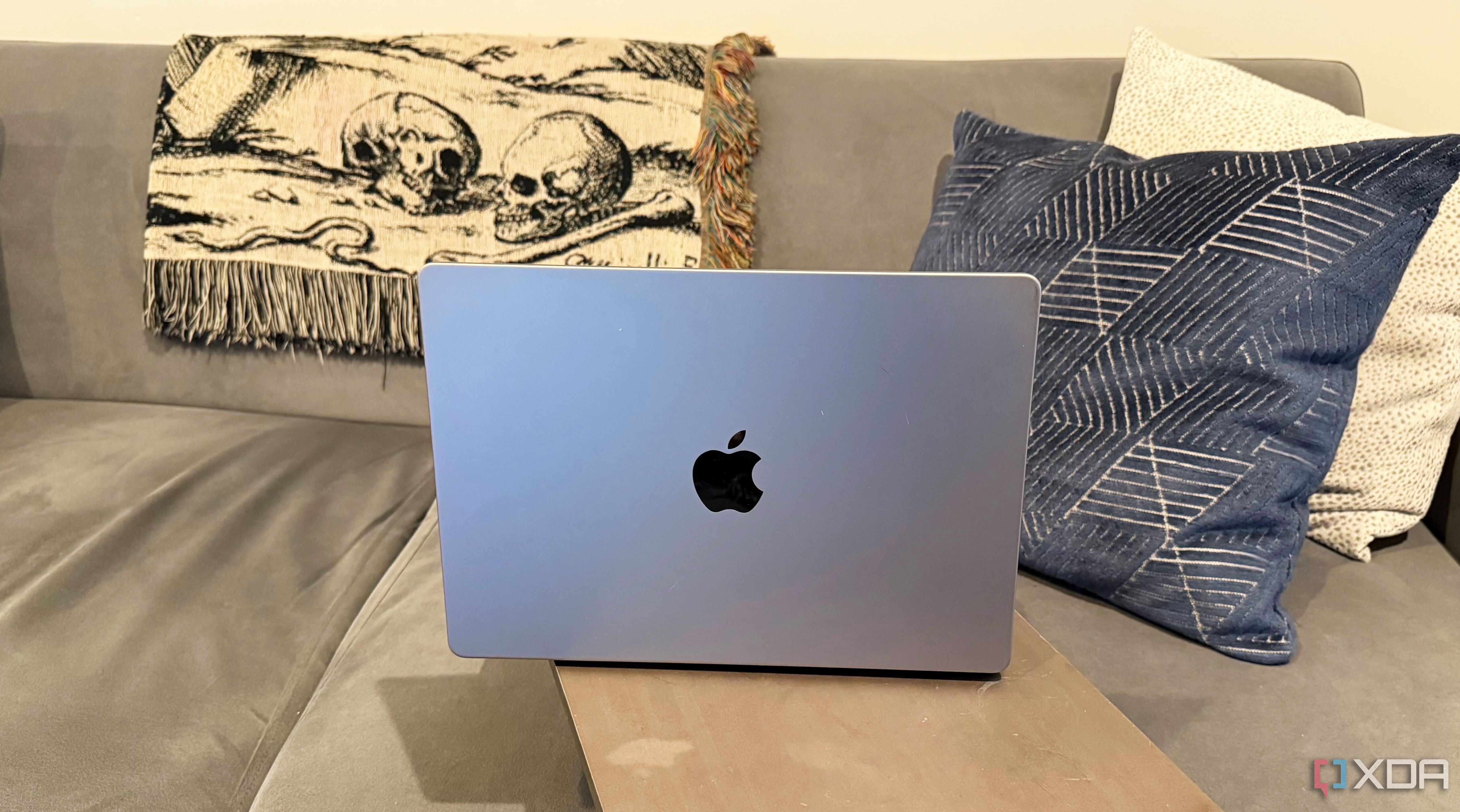 Couch work-from-home setup with an Apple MacBook Pro 14