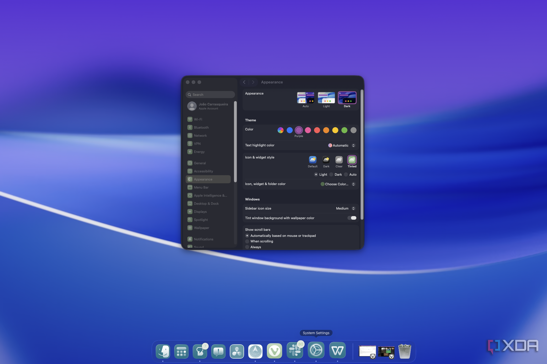 Screenshot of macOS cusotmization in dark mode with a purple accent and showing tinted translucent icons on the dock