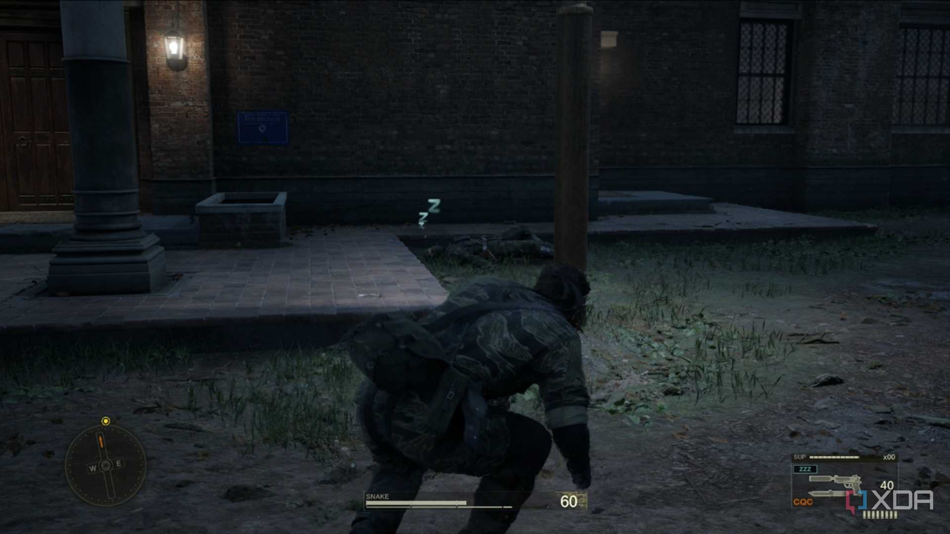 A screenshot of Snake sneaking around a downed guard in Metal Gear Solid Delta: Snake Eater