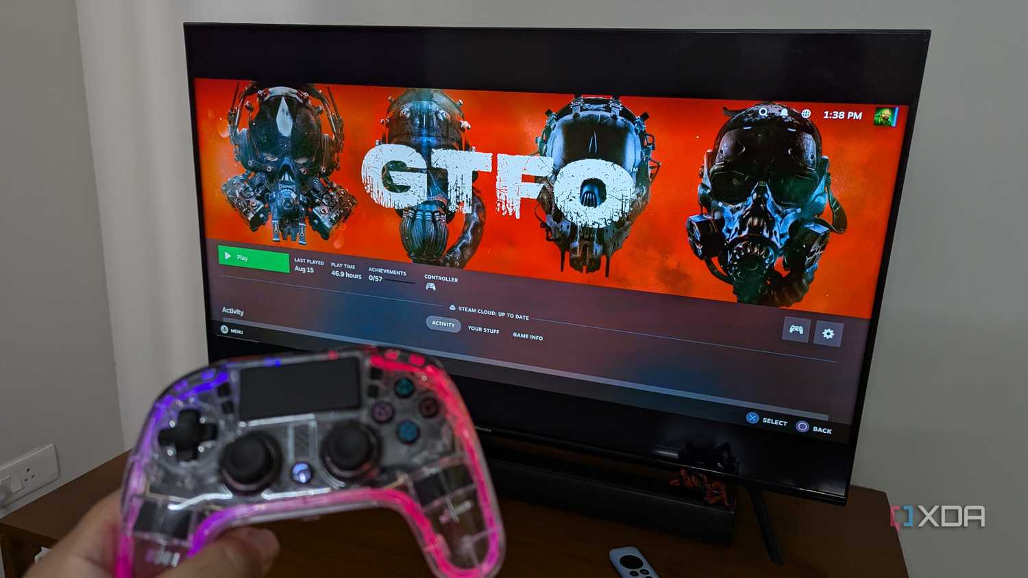 An RGB controller next to a TV running Steam Link