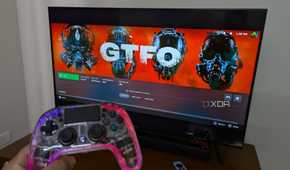 An RGB controller next to a TV running Steam Link