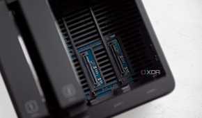 Ugreen DH4300 Plus with two open HDD slots, showing the SATA and power connectors for those HDDs. Numbers "1" and "2" are visible on the drive bays that are connected to the left.