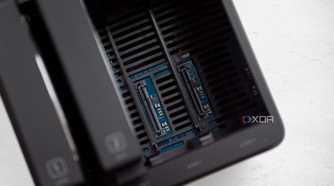 Ugreen DH4300 Plus with two open HDD slots, showing the SATA and power connectors for those HDDs. Numbers "1" and "2" are visible on the drive bays that are connected to the left.