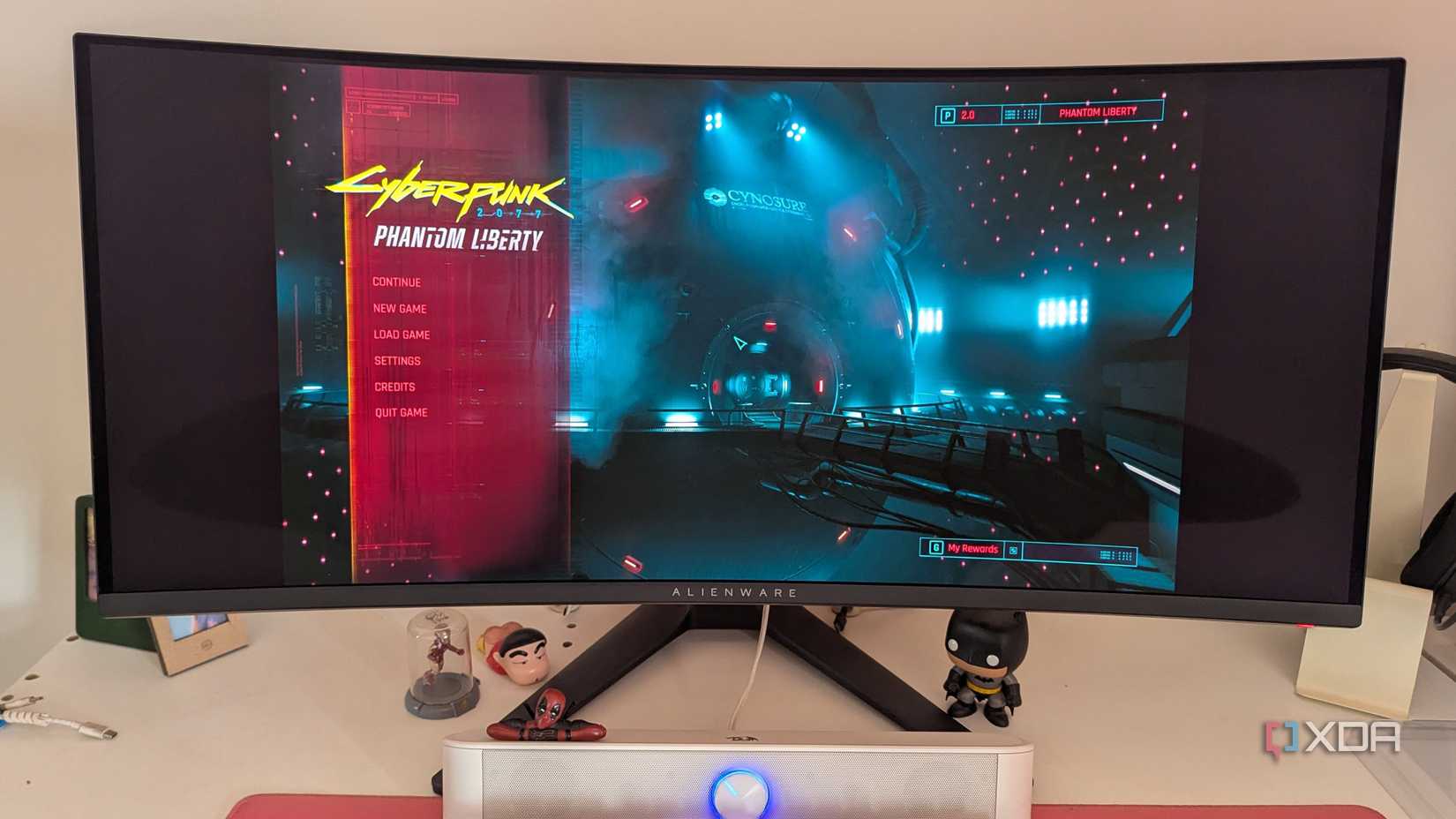 Ultrawide monitor showing Cyberpunk 2077 main menu with black bars on the sides