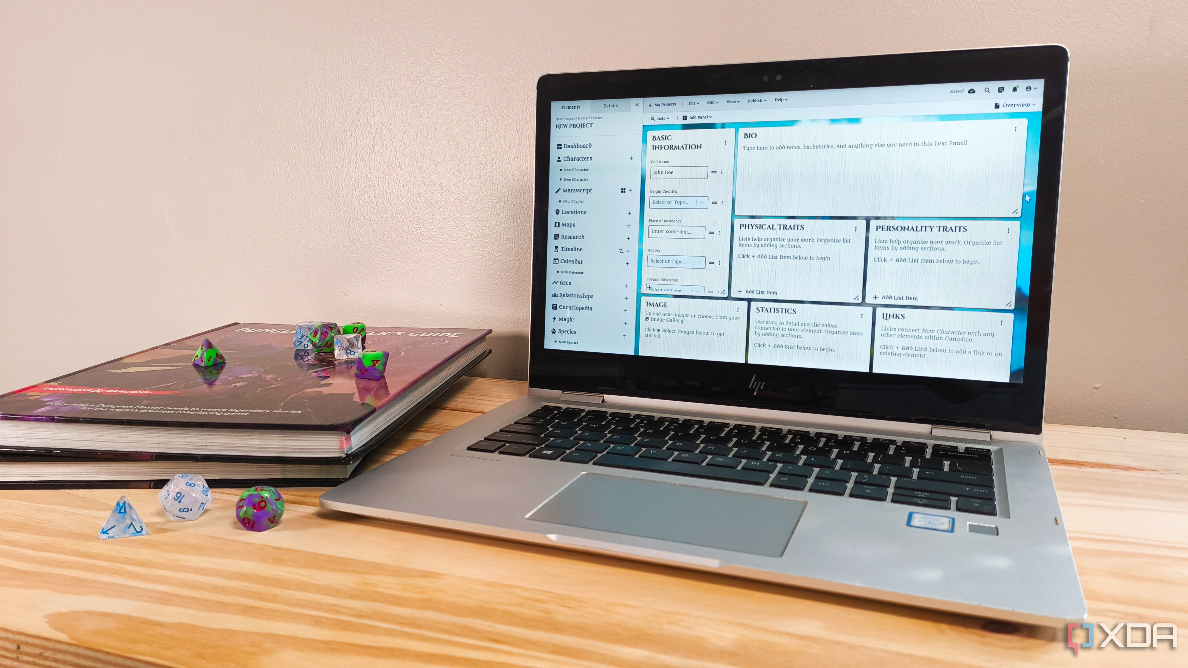 A laptop with a Campfire project on screen next to a stack of Dungeons & Dragons books and some dice