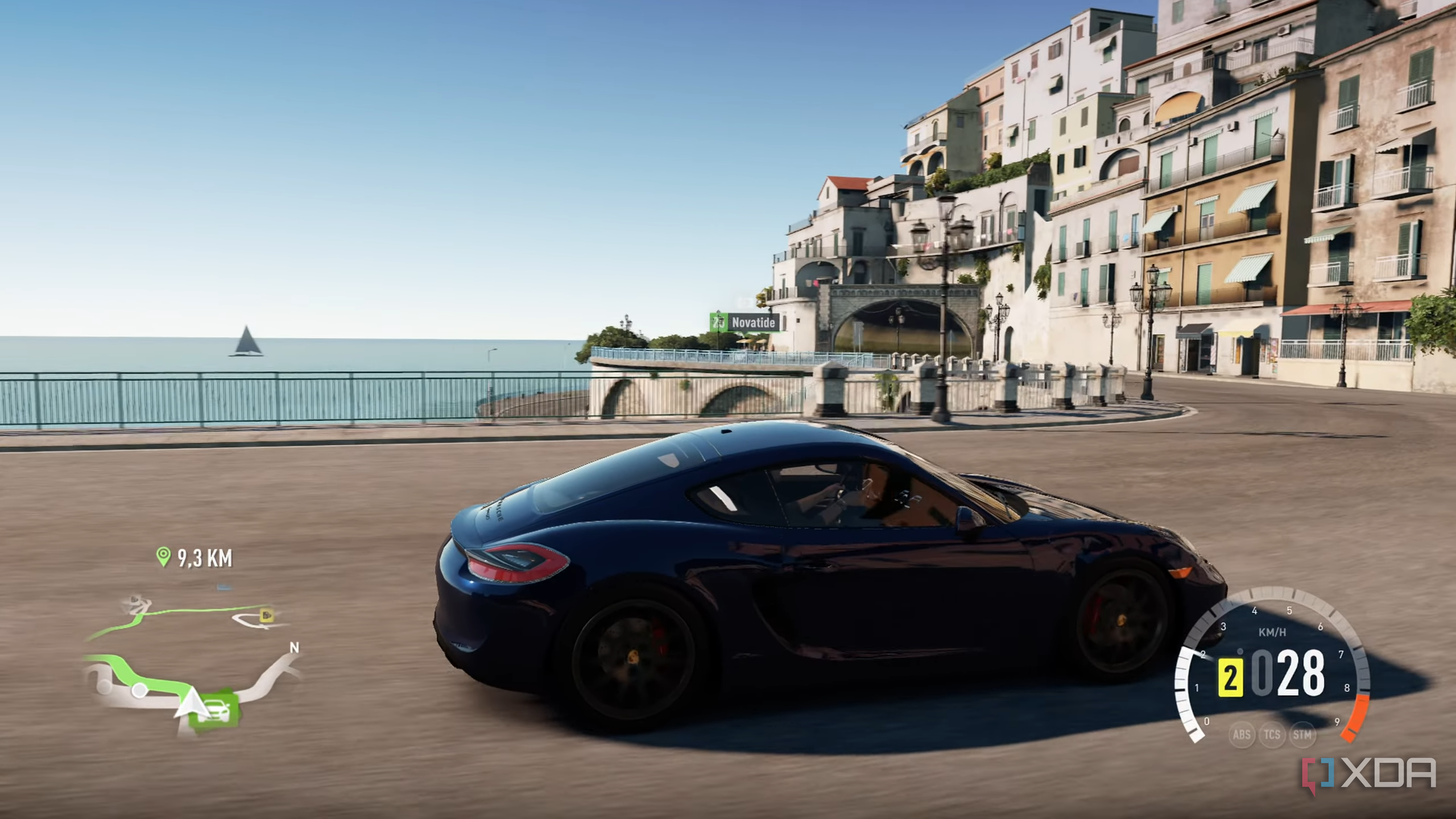 A blue Porsche racing down the Italian coast in Forza Horizon 2.