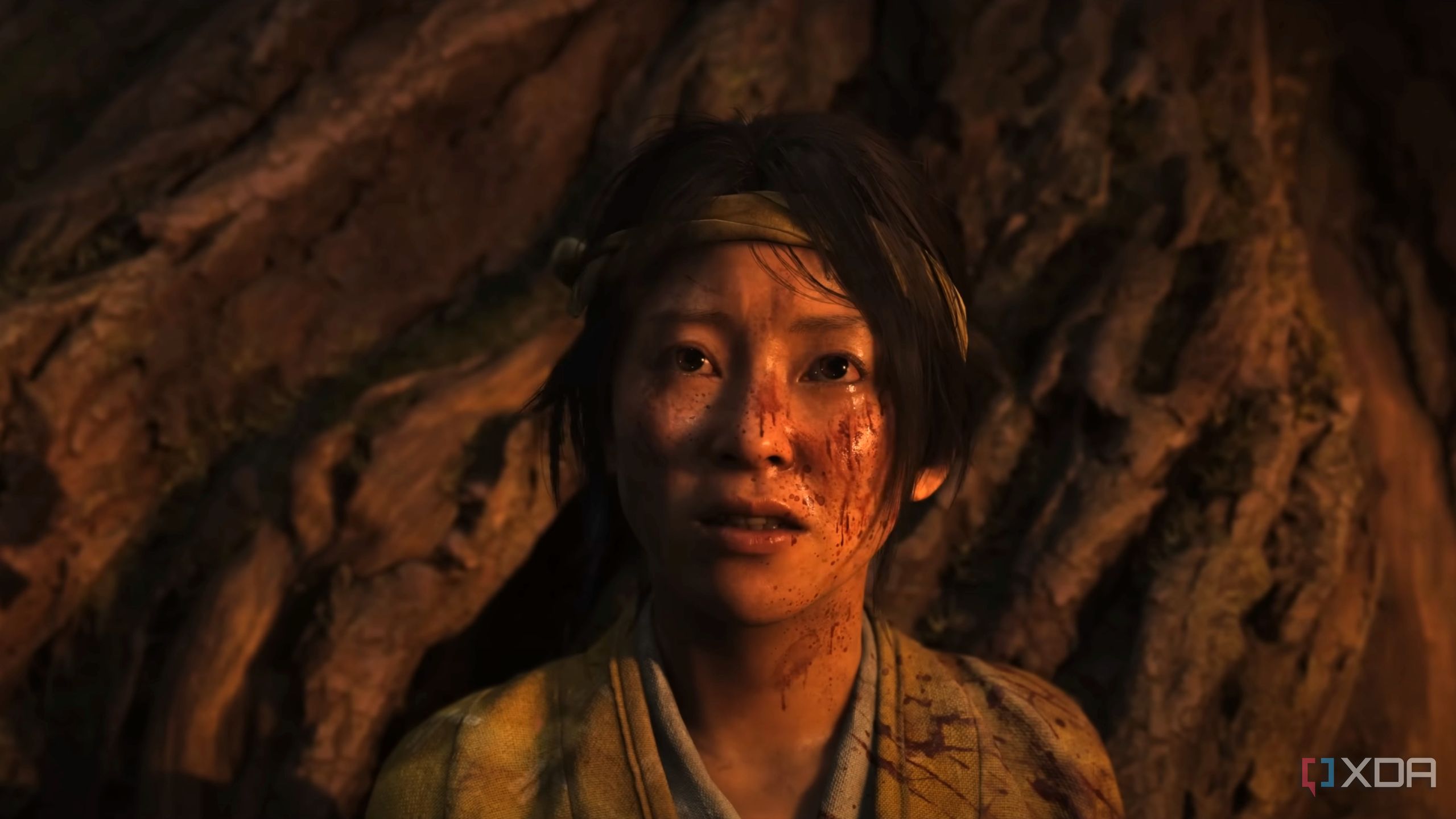 A young and bloodied Atsu in Ghost of Yotei.