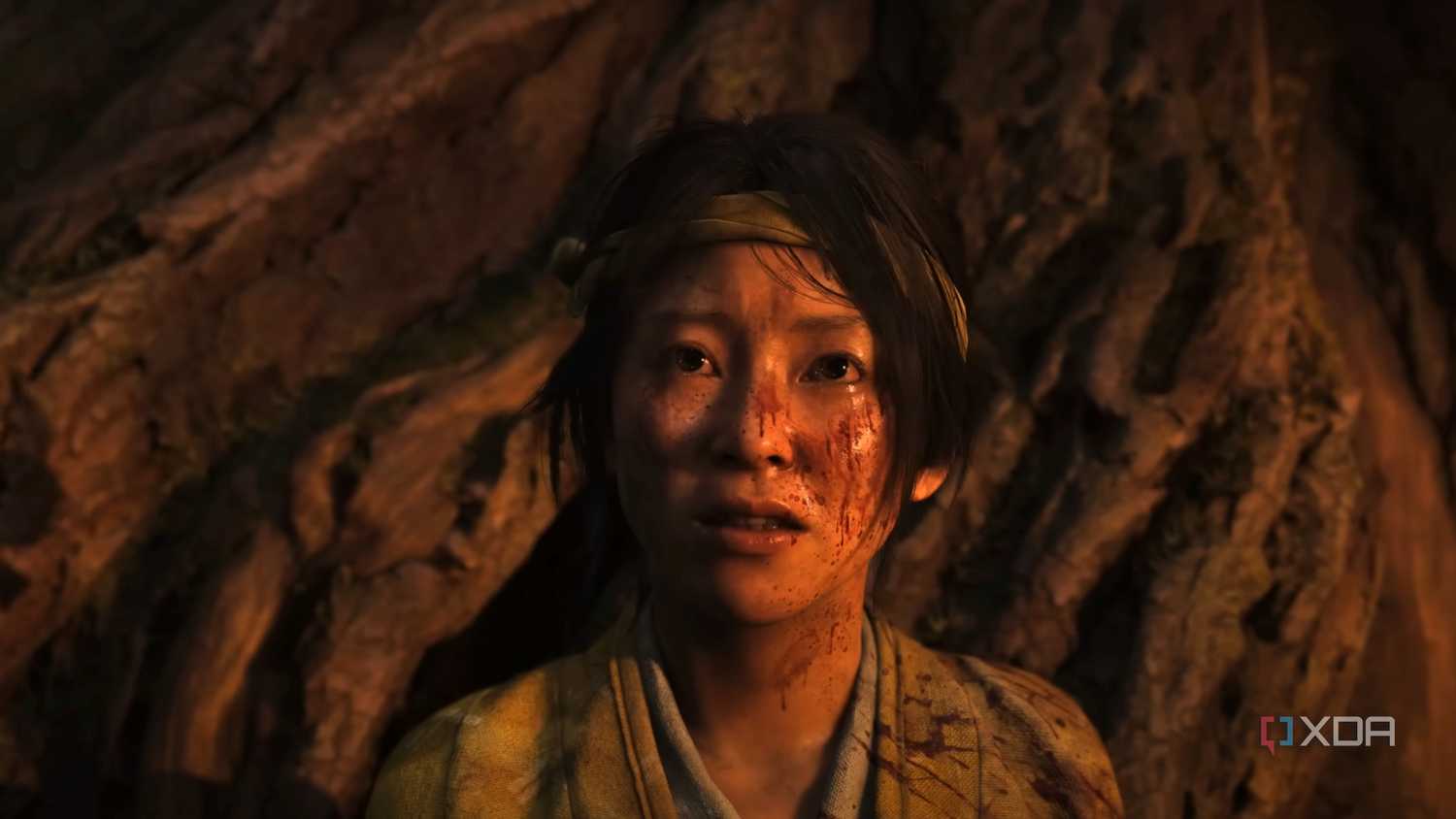 A young and bloodied Atsu in Ghost of Yotei.