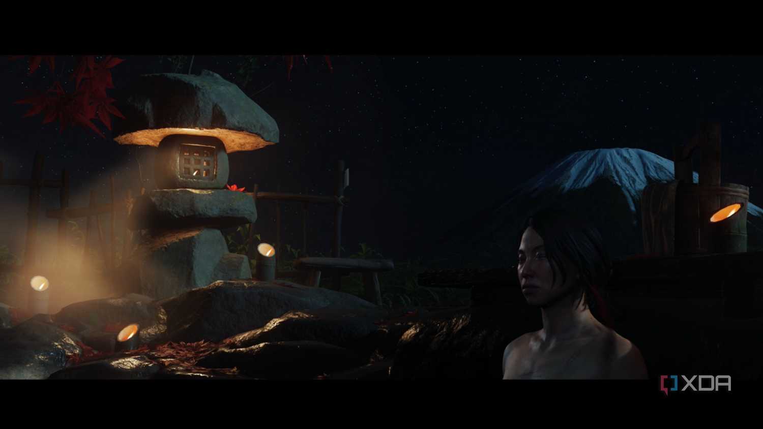 A screenshot of Atsu soaking in a hot spring in Ghost of Yotei