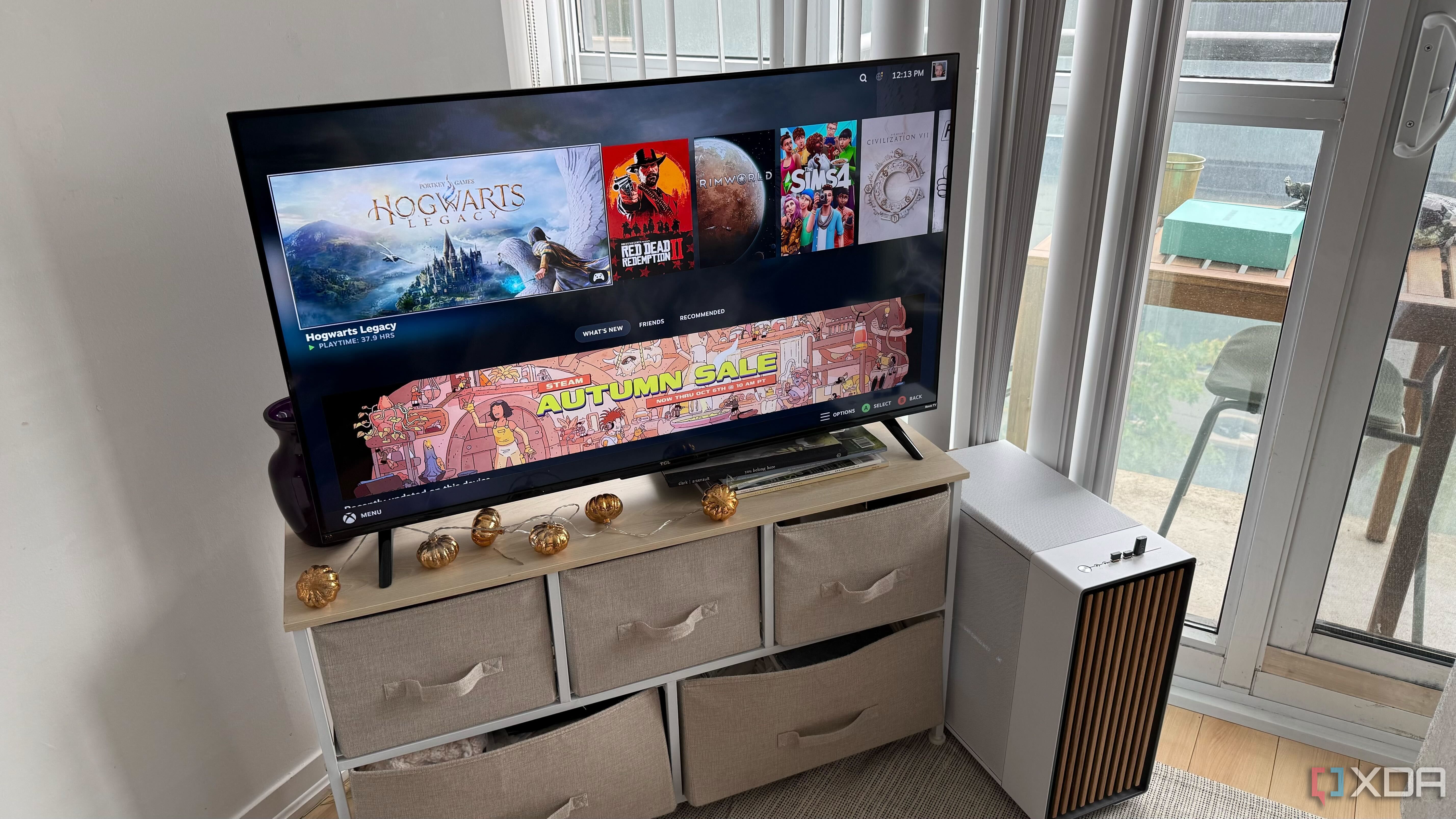 A photo of a gaming PC inside a Fractal case in a living room.