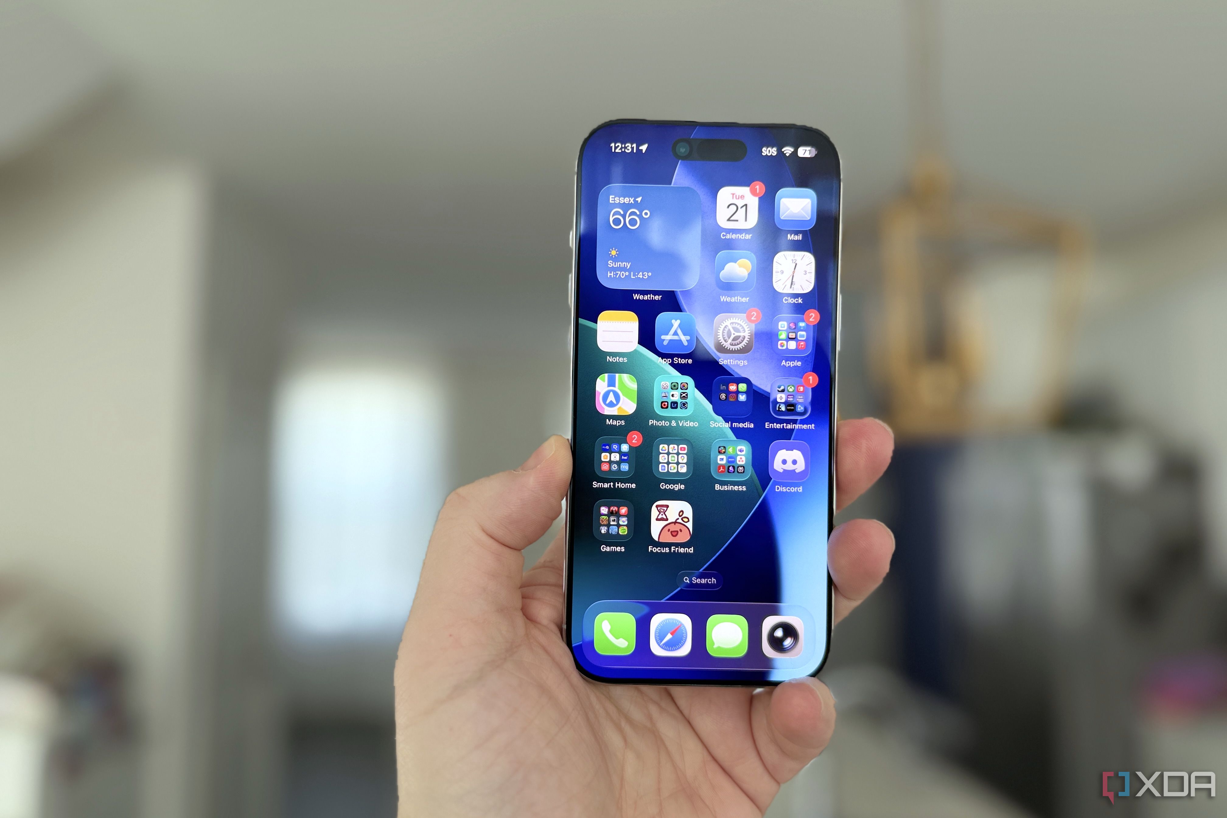 iphone air held in hand with home screen visible