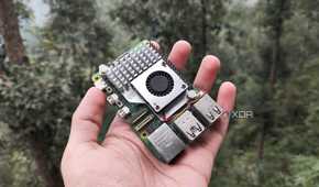 A person holding a Raspberry Pi 5