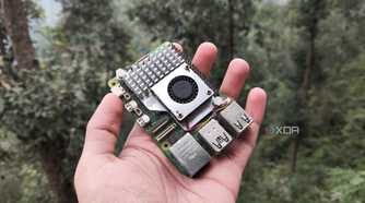 A person holding a Raspberry Pi 5