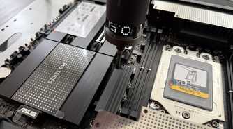 screwing down threadripper motherboard to test bench