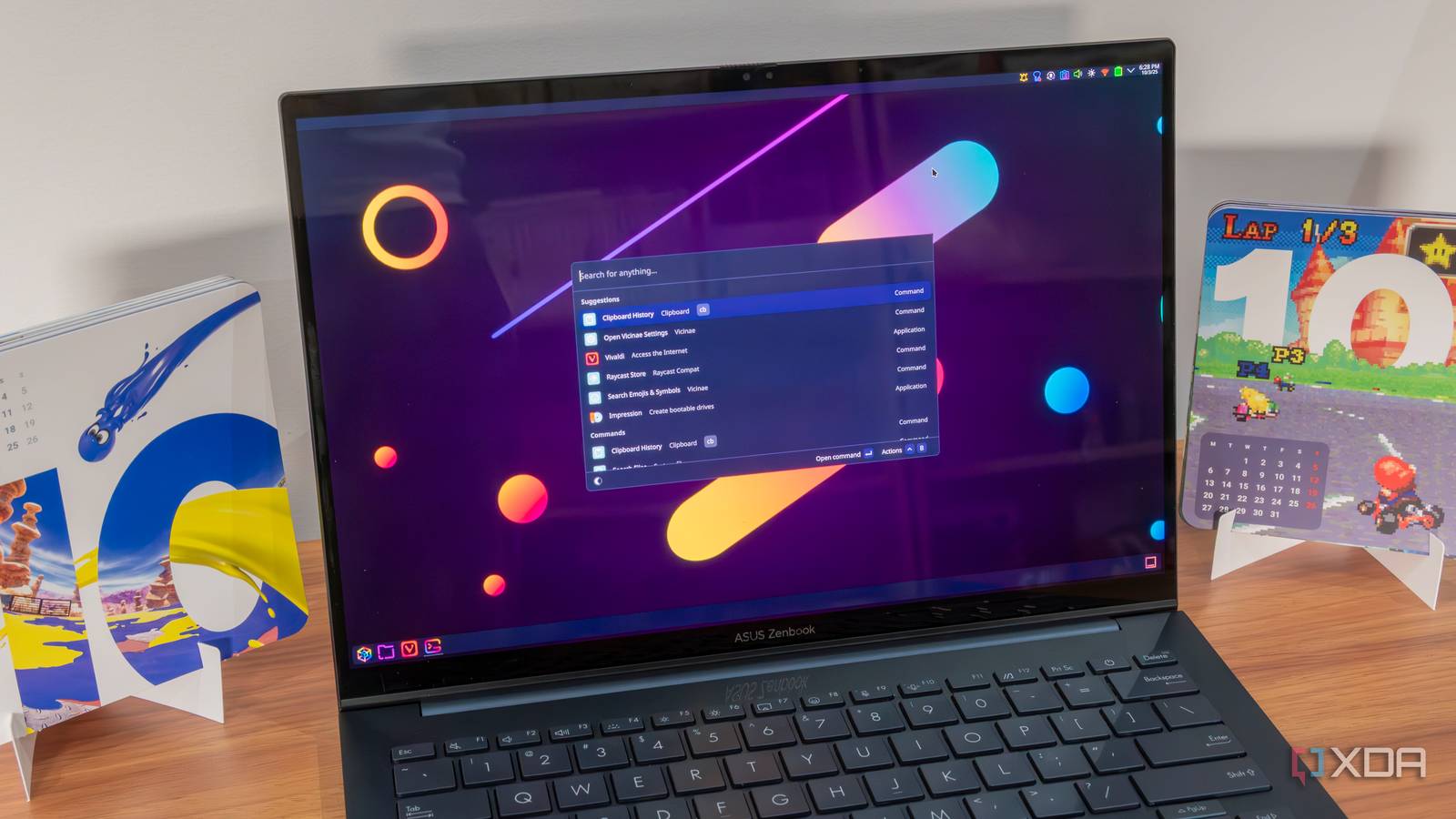 KDE Plasma Introduces Advanced Microphone Controls and System Enhancements 1 A laptop running KDE Plasma showing the Vicinae launcher