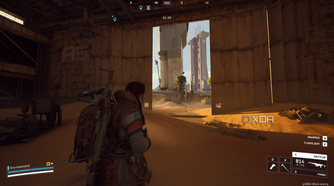 A vehicle maintenance facility overrun by sand in Arc Raiders' Spaceport map.