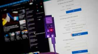ESP32 in front of the XDA home page and the NAT router setup page
