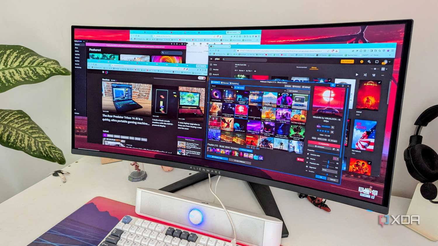 A curved PC monitor showing multiple windows open on the desktop