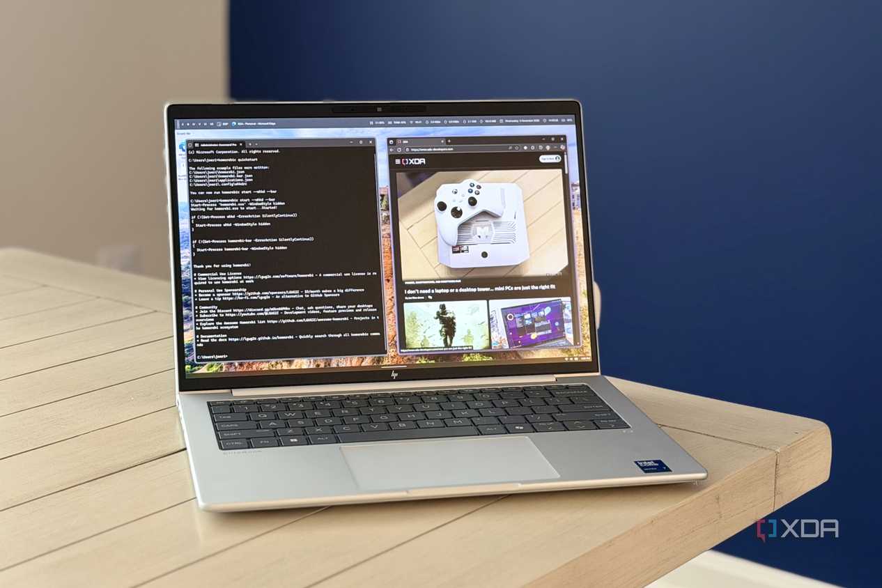 laptop on white table showing komorebi tiling window manager in action