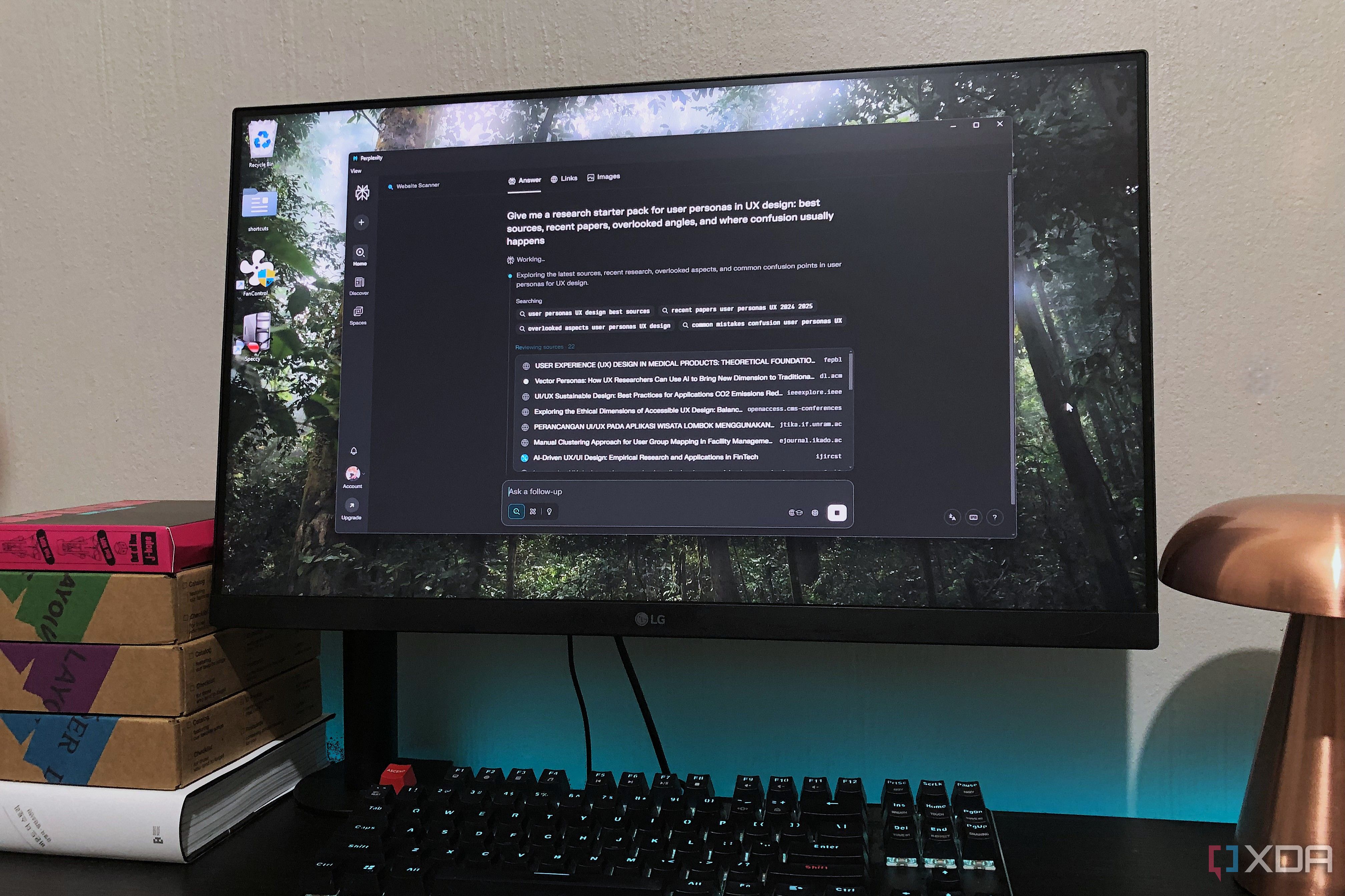 Prompting perplexity on desktop pc, lamp and albums in view